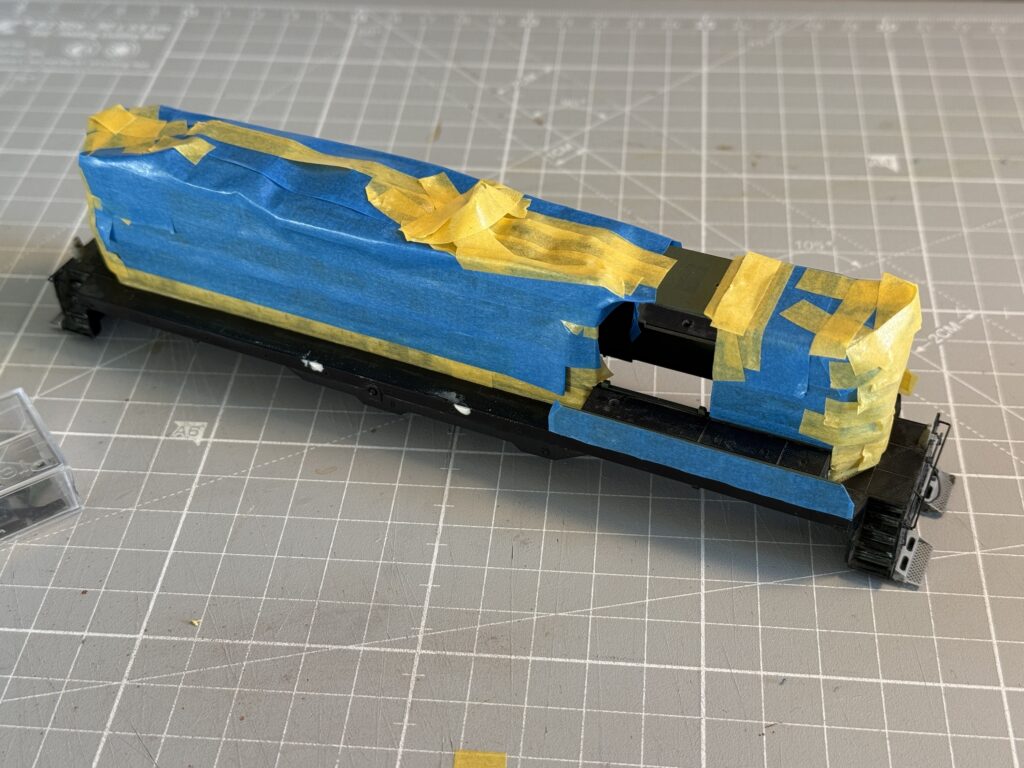 Last masking step before painting front and rear pilots.