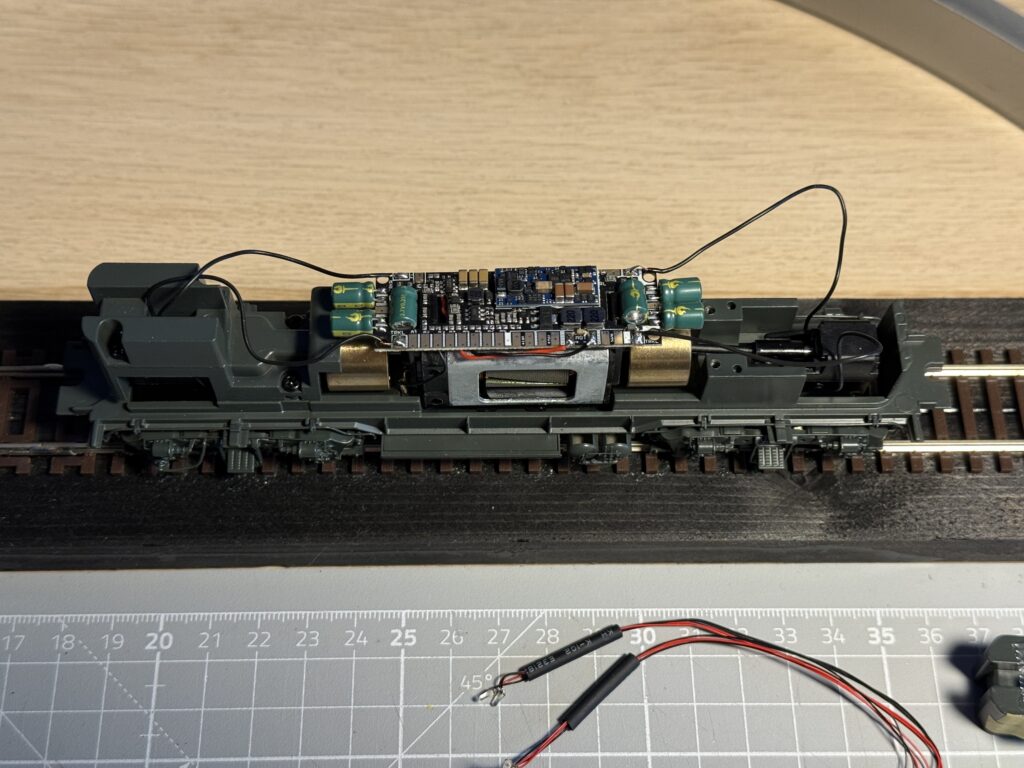 Rail pickup and motor wires soldered to the corresponding pads.