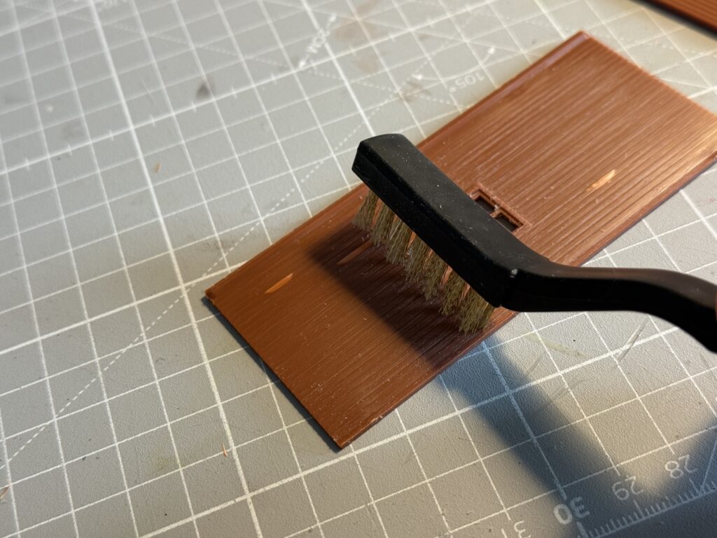 Wire-brushing the plastic to add texture