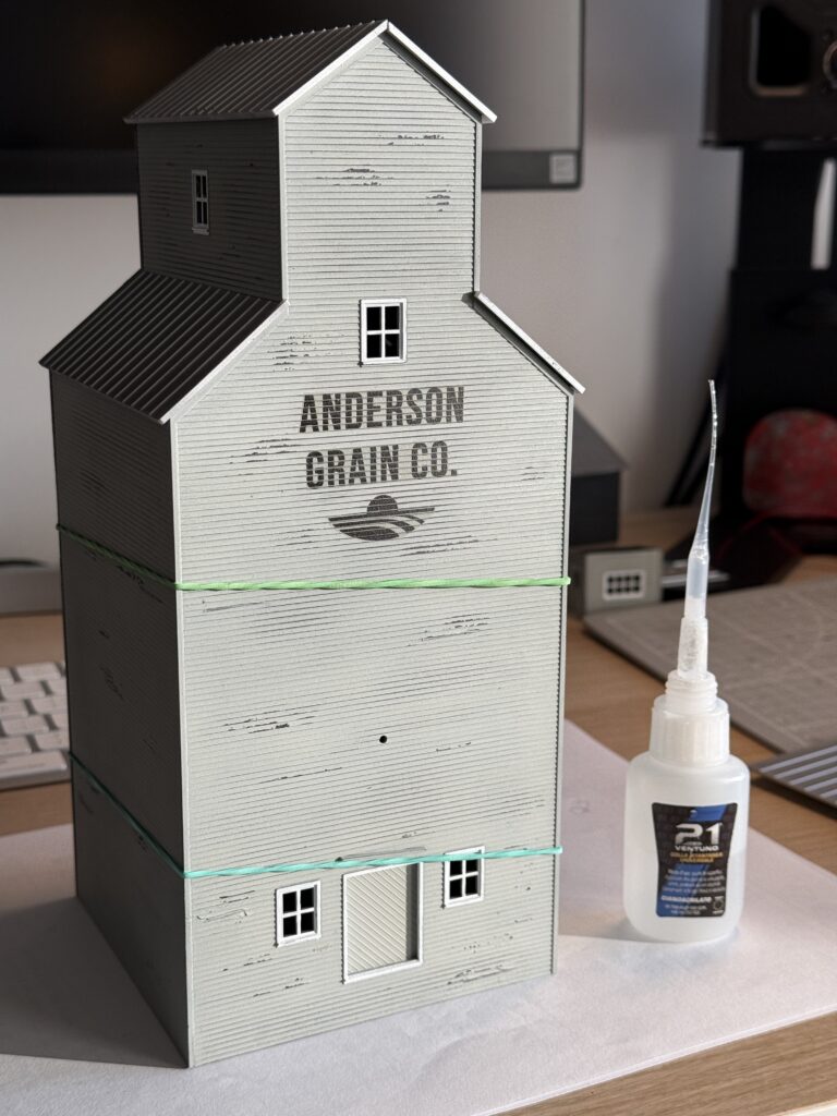 Rubber bands holding the glued walls.