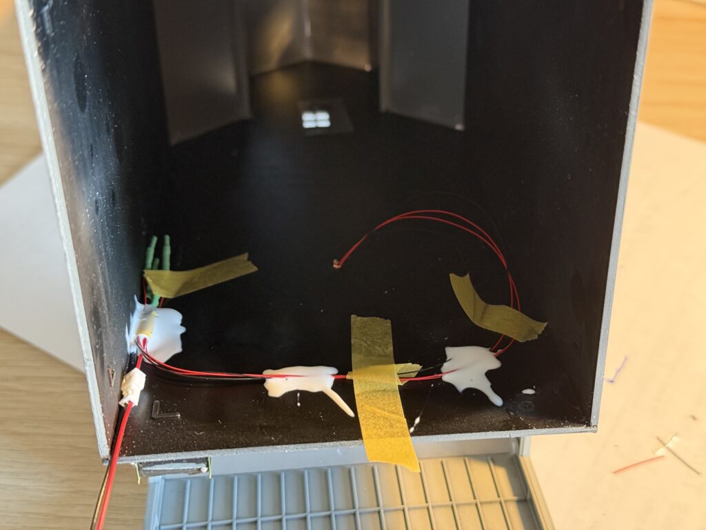 Securing wires on the inside of Anderson Grain Co. Elevator