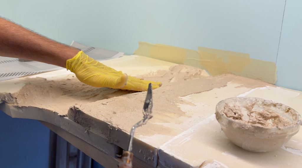 Filling in with papier-mâché.
