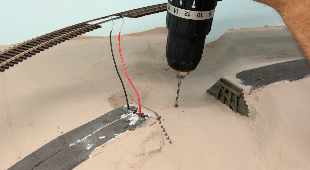 Drilling holes and building a bridge over the Buffalo Creek