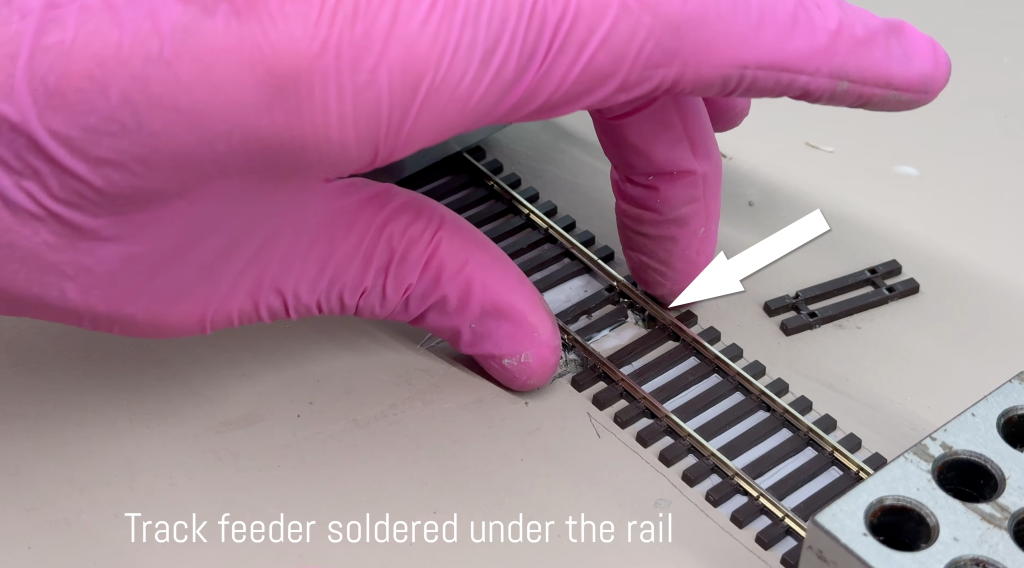 Golden spike! Filling in missing ties where track feeders are.