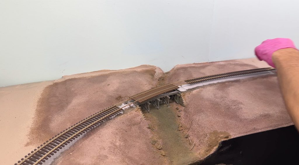 Pushing the track into place.