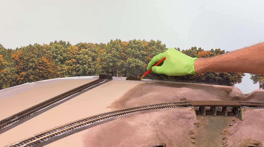 Painting gaps in backdrops with dark green gouache