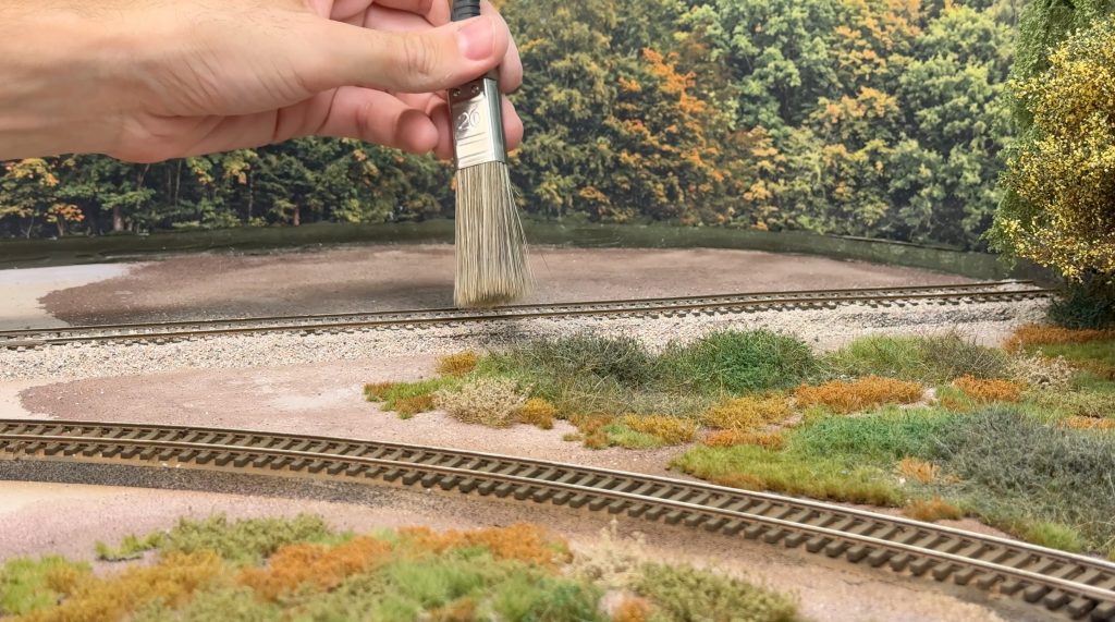 Distributing the ballast with a soft brush
