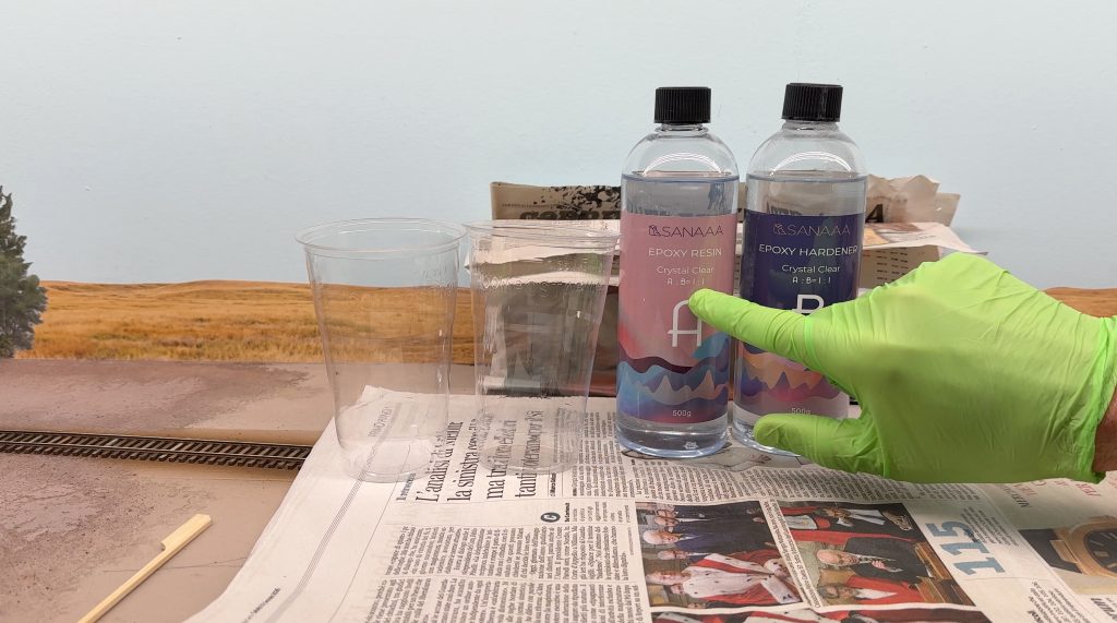 Using two-part epoxy resin for the Buffalo Creek water effect.