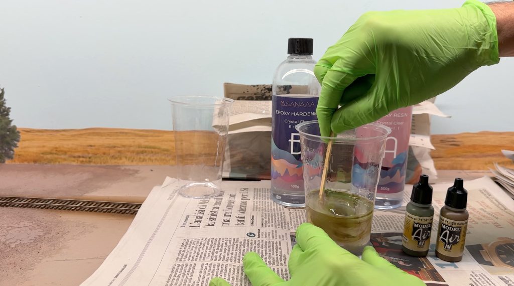 Mixing the paint drops with resing
