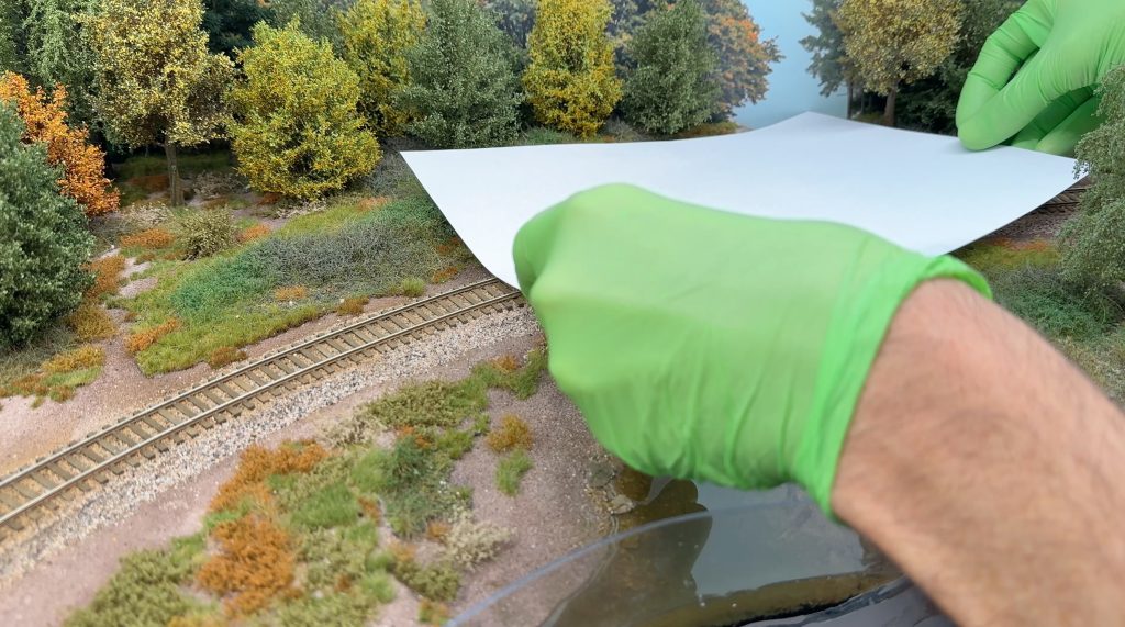 Protecting the resin from dust by covering the scene with paper sheets.